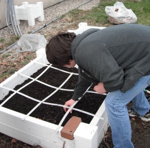 Prepping the garden beds for planting.